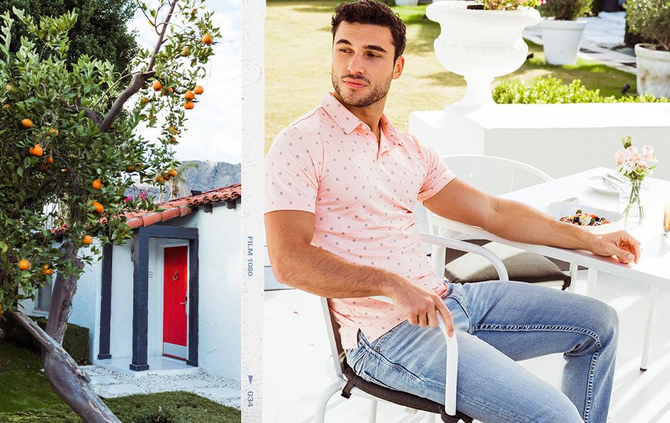 Men's New Arrivals - A guy wearing a pink polo with a pair of medium wash jeans.